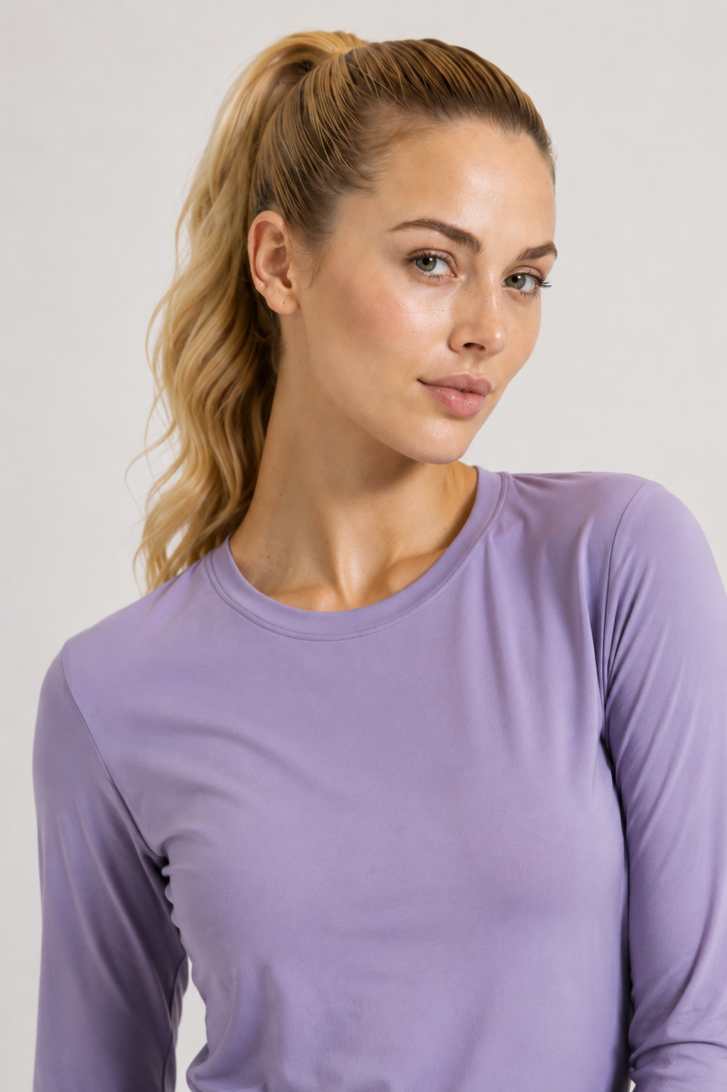 women’s long sleeve active top light purple portrait close up