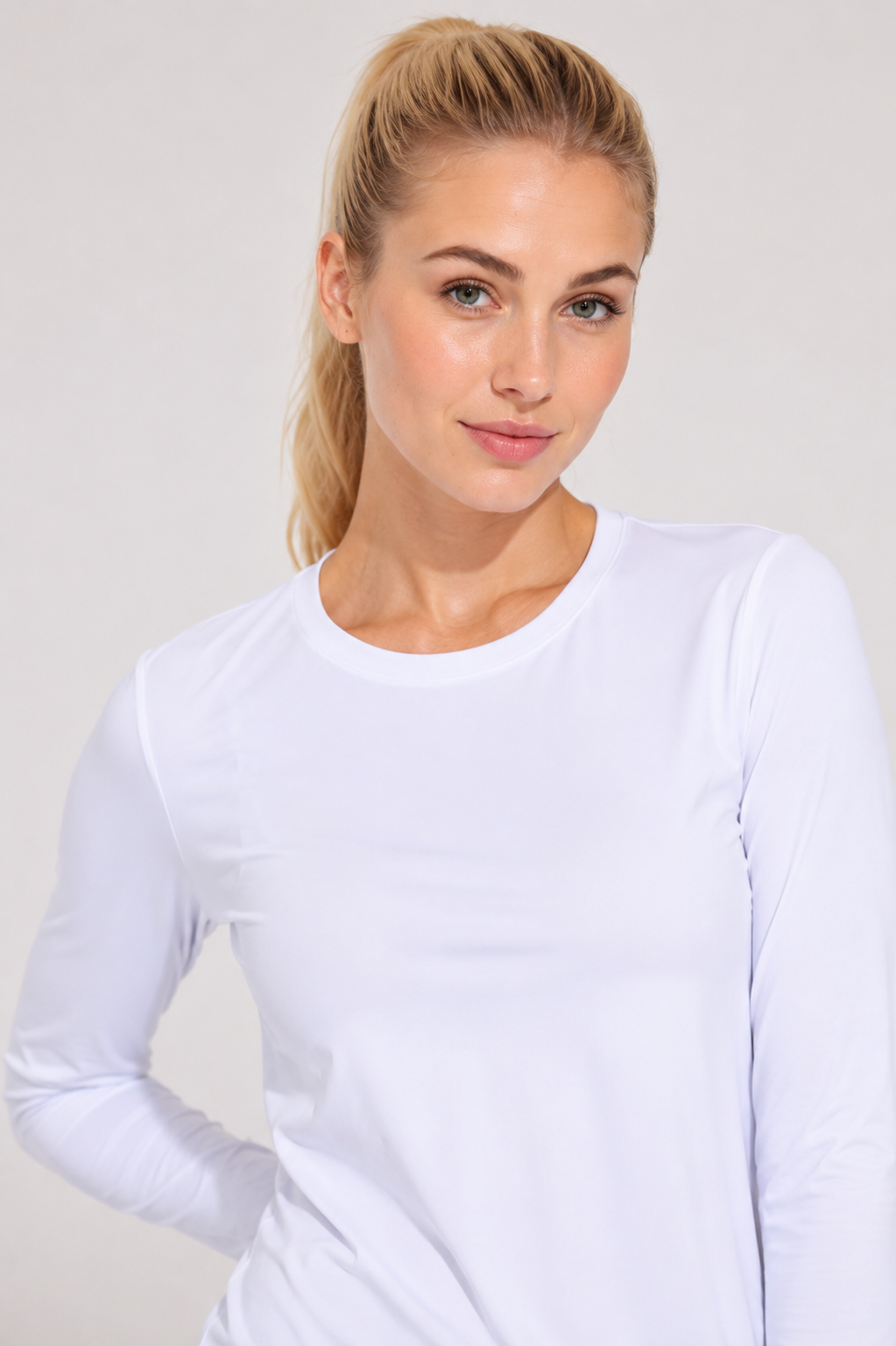 women’s long sleeve active top white portrait close up