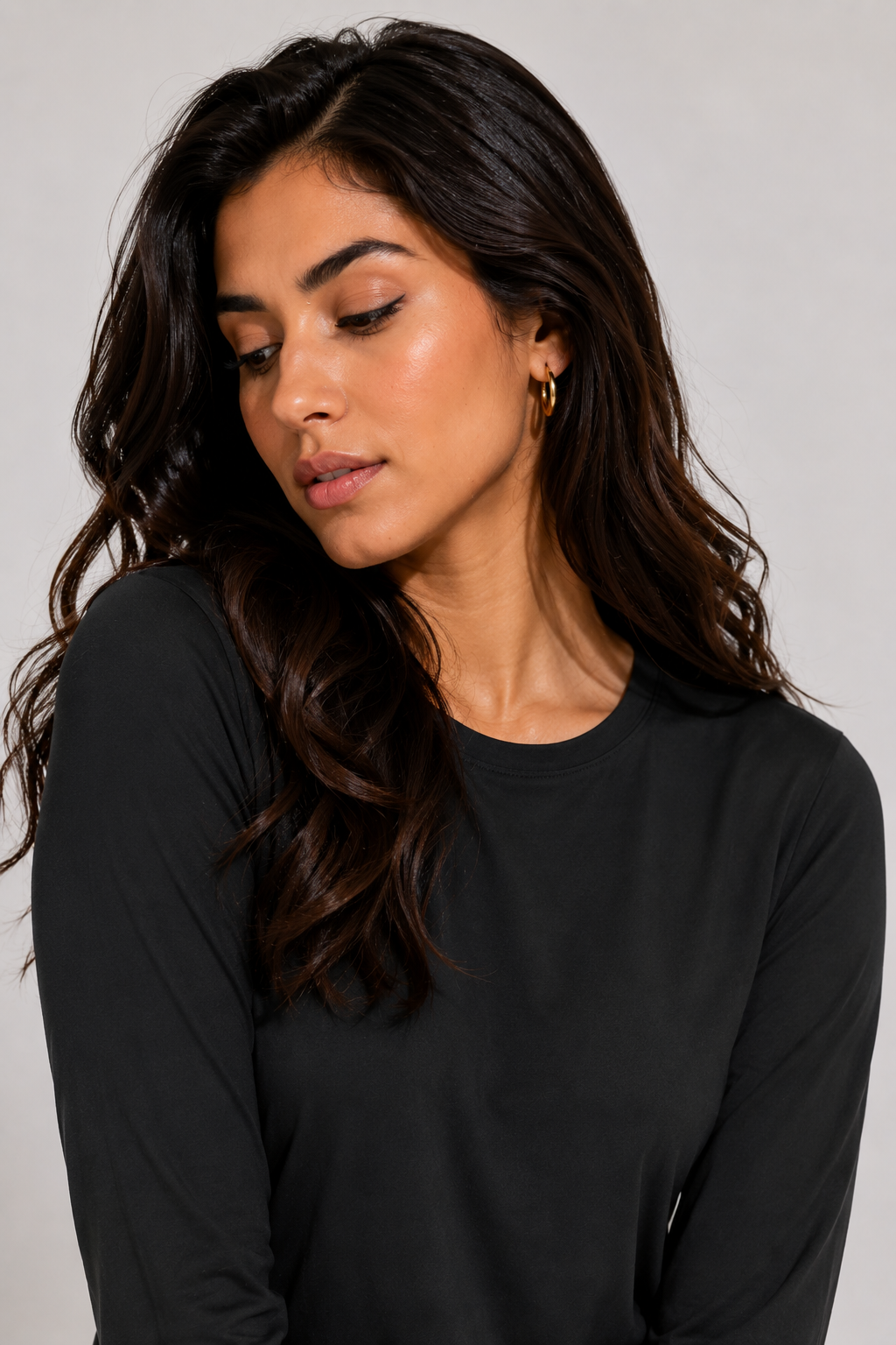 women’s long sleeve active top black portrait close up