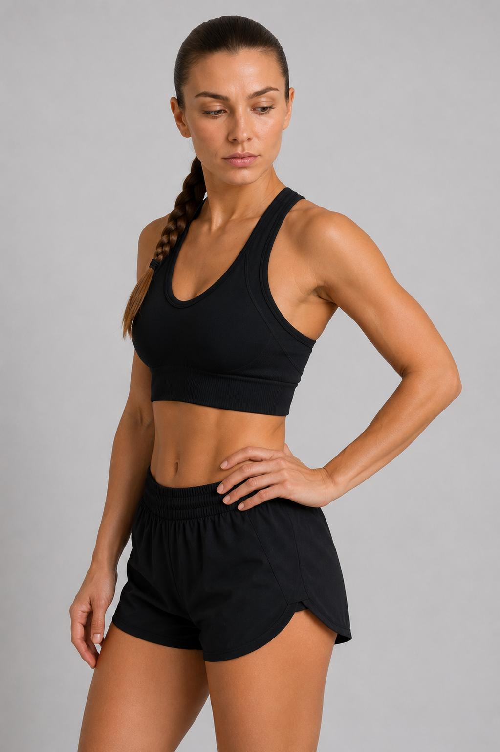 seamless racerback sports bra black standing pose